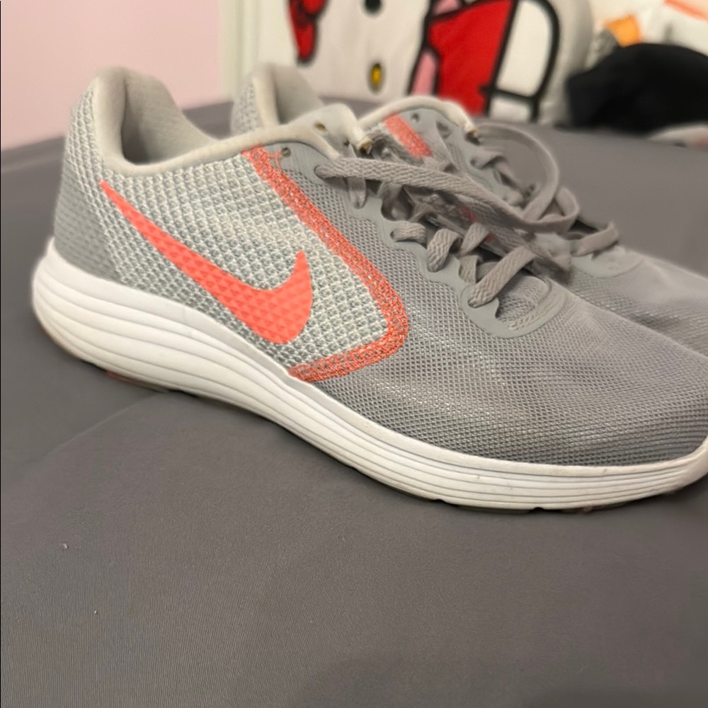 Nike Gray and Pink Sneakers with Minimalist Design